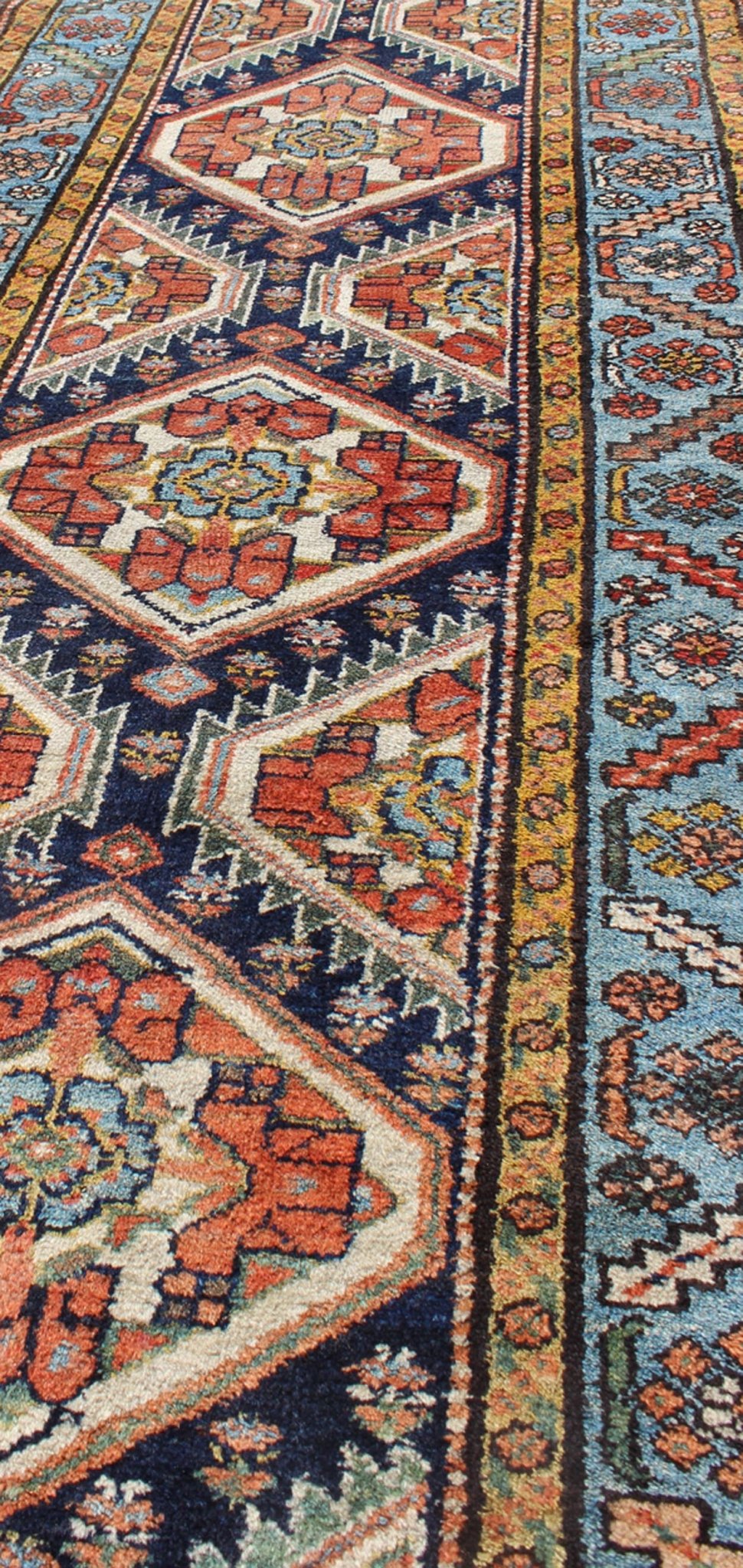 Colorful 1920s Antique N.W. Persian Runner with Sub - Geometric Medallions, rug e - 0603, country of origin / type: Iran / N.W. Persian, circa 1920 This Northwest Persian runner features a deep blue background flanked by multiple light blue and yell... - Keivan Woven ArtsE - 0603 - 1446Rug