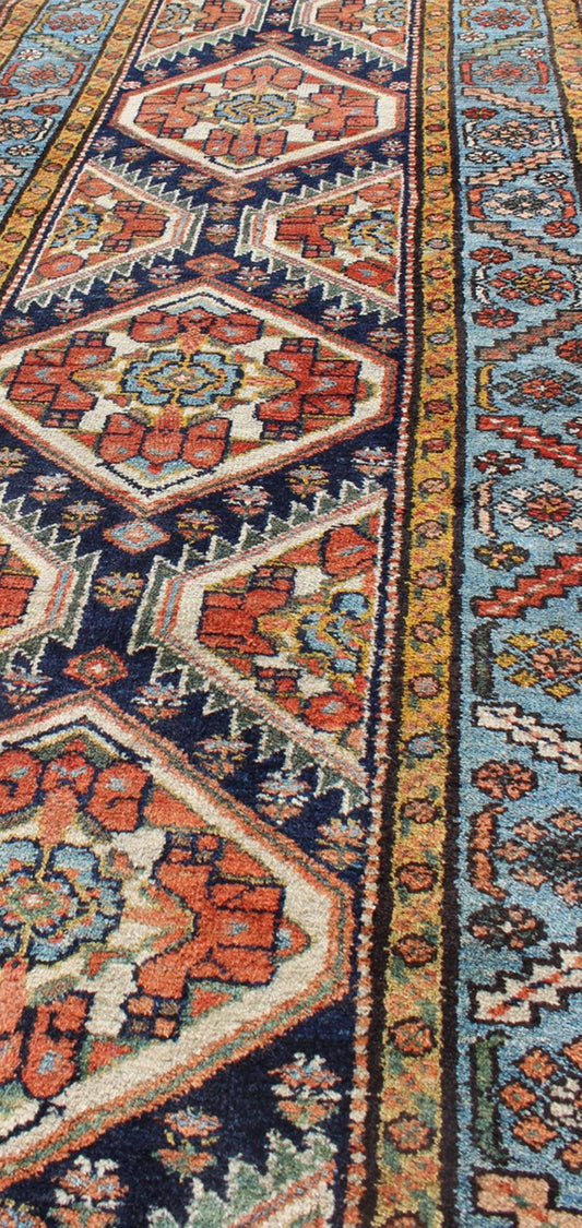 Colorful 1920s Antique N.W. Persian Runner with Sub - Geometric Medallions, rug e - 0603, country of origin / type: Iran / N.W. Persian, circa 1920 This Northwest Persian runner features a deep blue background flanked by multiple light blue and yell... - Keivan Woven ArtsE - 0603 - 1446Rug