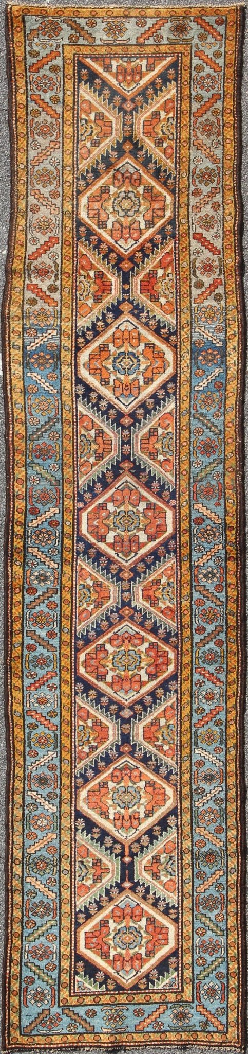 Colorful 1920s Antique N.W. Persian Runner with Sub - Geometric Medallions, rug e - 0603, country of origin / type: Iran / N.W. Persian, circa 1920 This Northwest Persian runner features a deep blue background flanked by multiple light blue and yell... - Keivan Woven ArtsE - 0603 - 1446Rug