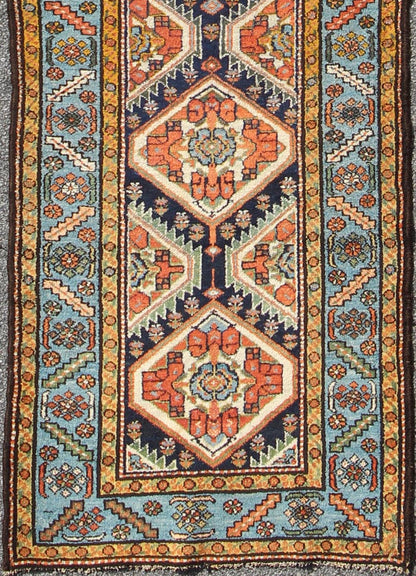 Colorful 1920s Antique N.W. Persian Runner with Sub - Geometric Medallions, rug e - 0603, country of origin / type: Iran / N.W. Persian, circa 1920 This Northwest Persian runner features a deep blue background flanked by multiple light blue and yell... - Keivan Woven ArtsE - 0603 - 1446Rug