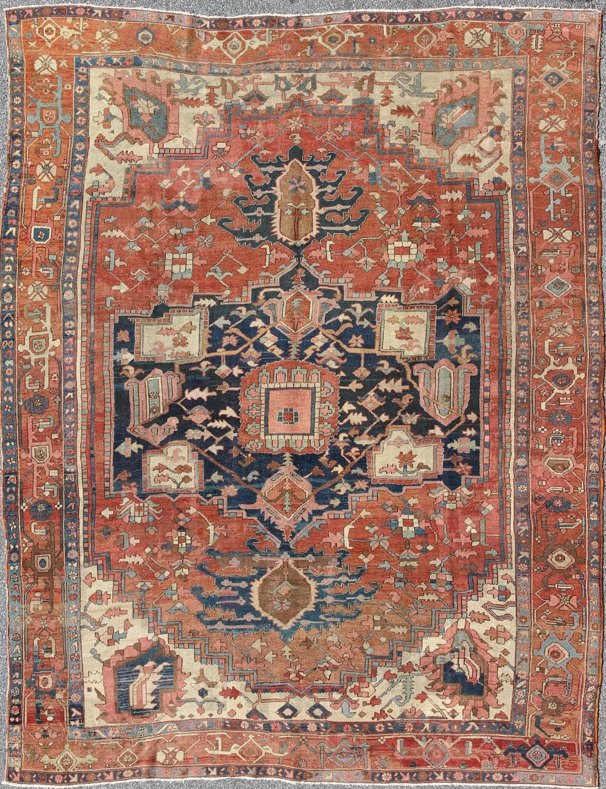 Antique Persian Serapi Rug With Medallion in Rusty - Orange, Blue and Cream's. Keivan Woven Arts / Rug / W22 - 0208, country of origin / type: Iran /Serapi, circa 1910. Antique Heriz, Antique Serapi. Measures: 9'8 x 11'4. Serapi rugs represent the f... - Keivan Woven ArtsE - 0804 - 665Rug