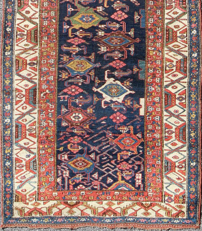 Red, blue, and ivory antique Persian Bidjar runner with all - over geometrics, rug e - 1002, country of origin / type: Iran / Bidjar, circa 1900 This magnificent early 20th century Persian Bidjar runner brilliantly incorporates breathtaking colo... - Keivan Woven ArtsE - 1002 - 1504Rug