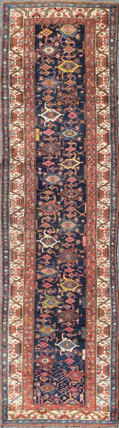 Red, blue, and ivory antique Persian Bidjar runner with all - over geometrics, rug e - 1002, country of origin / type: Iran / Bidjar, circa 1900 This magnificent early 20th century Persian Bidjar runner brilliantly incorporates breathtaking colo... - Keivan Woven ArtsE - 1002 - 1504Rug