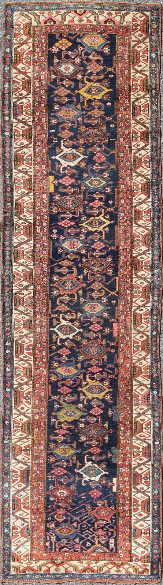 Red, blue, and ivory antique Persian Bidjar runner with all - over geometrics, rug e - 1002, country of origin / type: Iran / Bidjar, circa 1900 This magnificent early 20th century Persian Bidjar runner brilliantly incorporates breathtaking colo... - Keivan Woven ArtsE - 1002 - 1504Rug