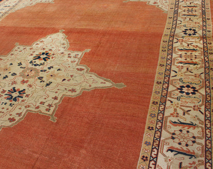 Large Antique Ziegler Sultanabad rug with central medallion in soft orange, ivory and pops of navy blue. Keivan Woven Arts / E - 1207. Late 19th Century Persian Antique Ziegler, antique Persian Ziegler. Measures: 10'2 x 14'5 This striking antique Z... - Keivan Woven ArtsE - 1207 - 1827Rug