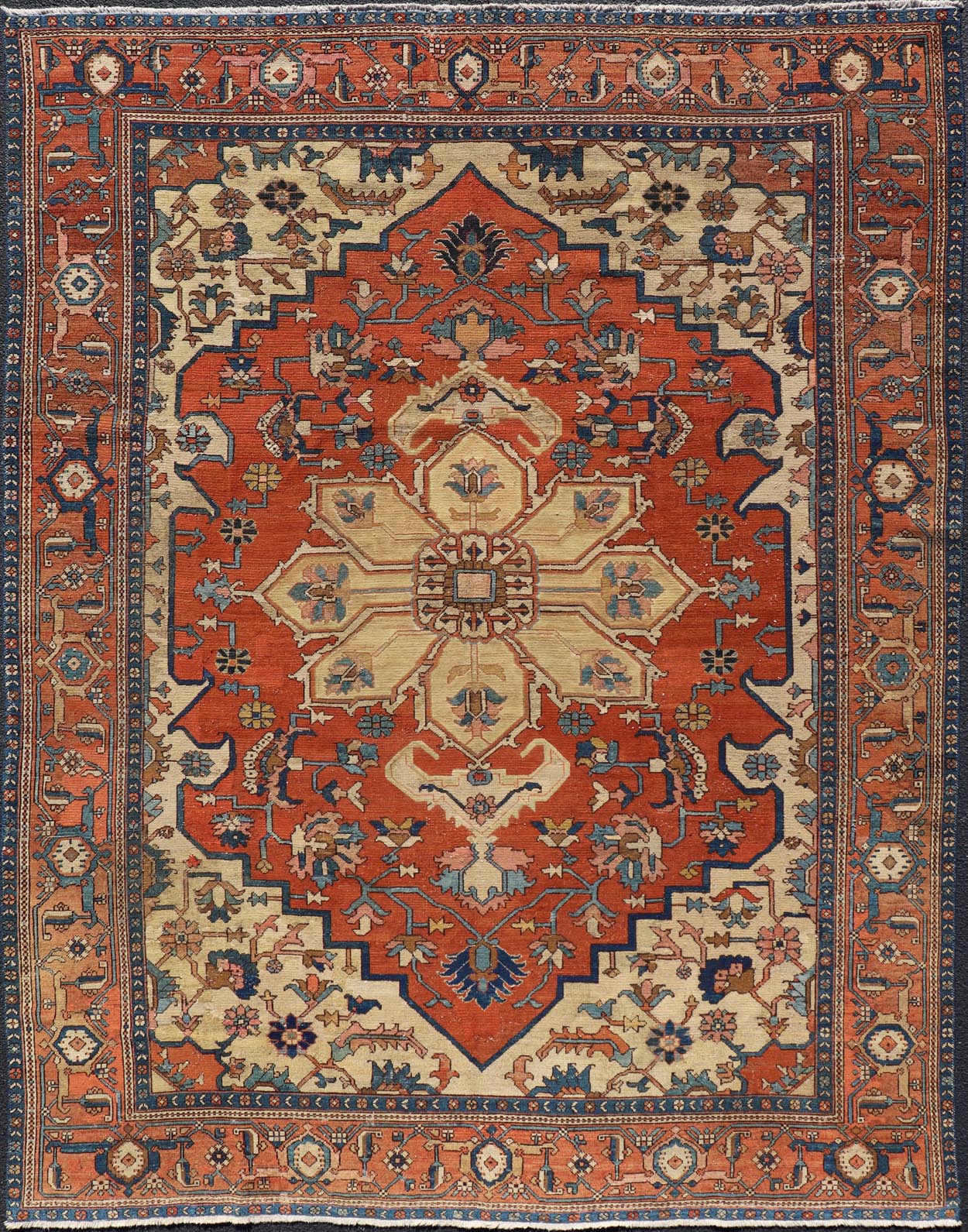 Antique Persian Serapi Rug in Geometric Medallion Design with Orange, blue & Cream. Antique Persian Serapi rug with colorful and detailed layered medallion in Rust, Orange, ivory & medium blue, light green, light orange, Salmon. Keivan Woven Ar... - Keivan Woven ArtsEB - 200644 - 13086Rug