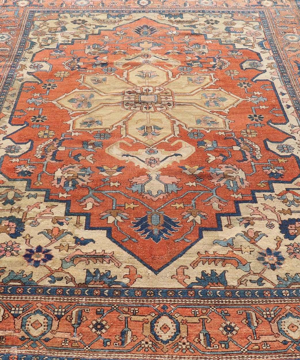 Antique Persian Serapi Rug in Geometric Medallion Design with Orange, blue & Cream. Antique Persian Serapi rug with colorful and detailed layered medallion in Rust, Orange, ivory & medium blue, light green, light orange, Salmon. Keivan Woven Ar... - Keivan Woven ArtsEB - 200644 - 13086Rug