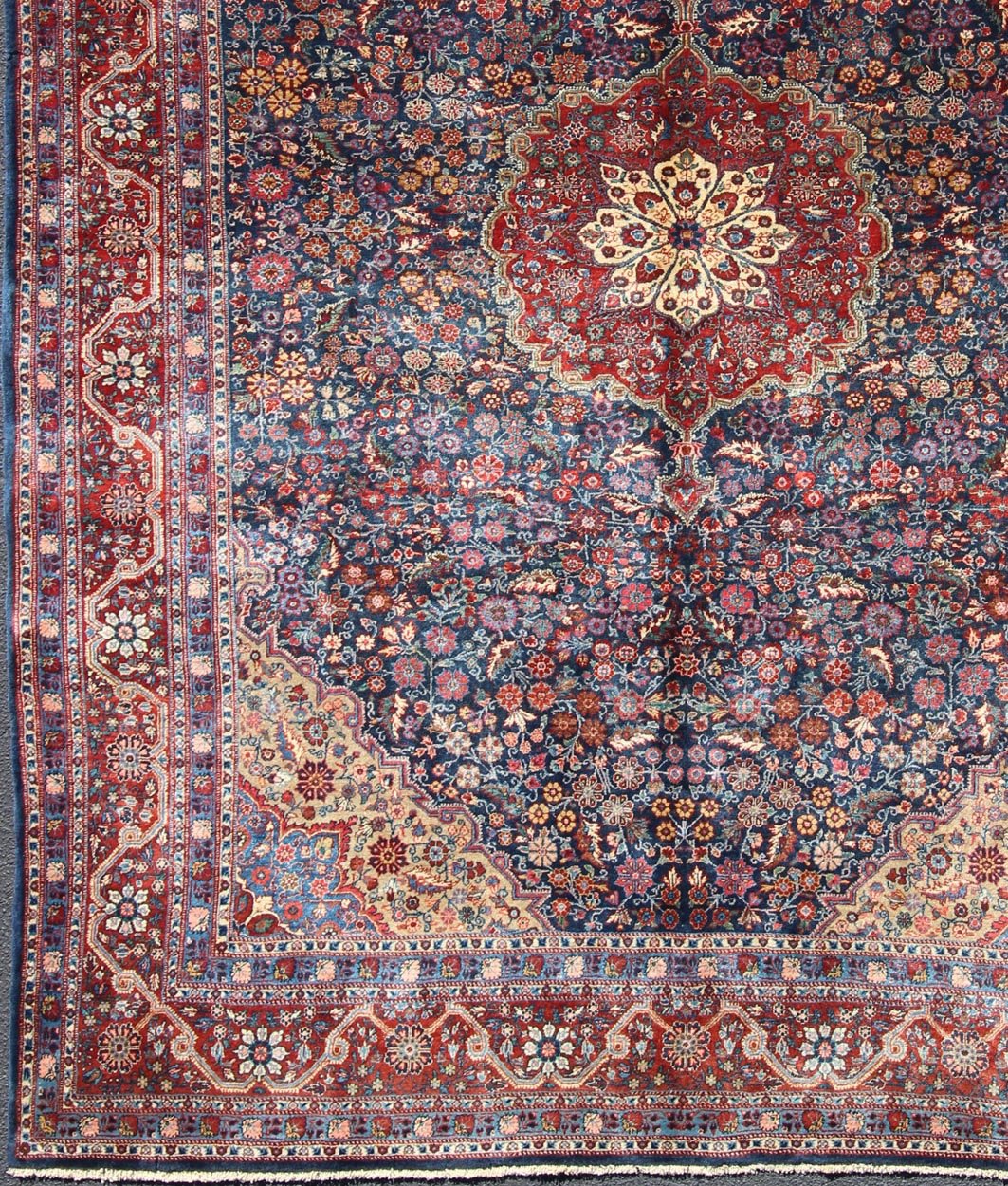 Antique Tribal Medallion Josan Rug with Jewel Tones with Center Medallion Blossoming antique Persian Josan rug with all - over Arabesque design in blue, rug EB - CON - 10001, country of origin / type: Iran / Josan, circa. 1900 Distinct colors ... - Keivan Woven ArtsEB - CON - 10001 - 12601Rug