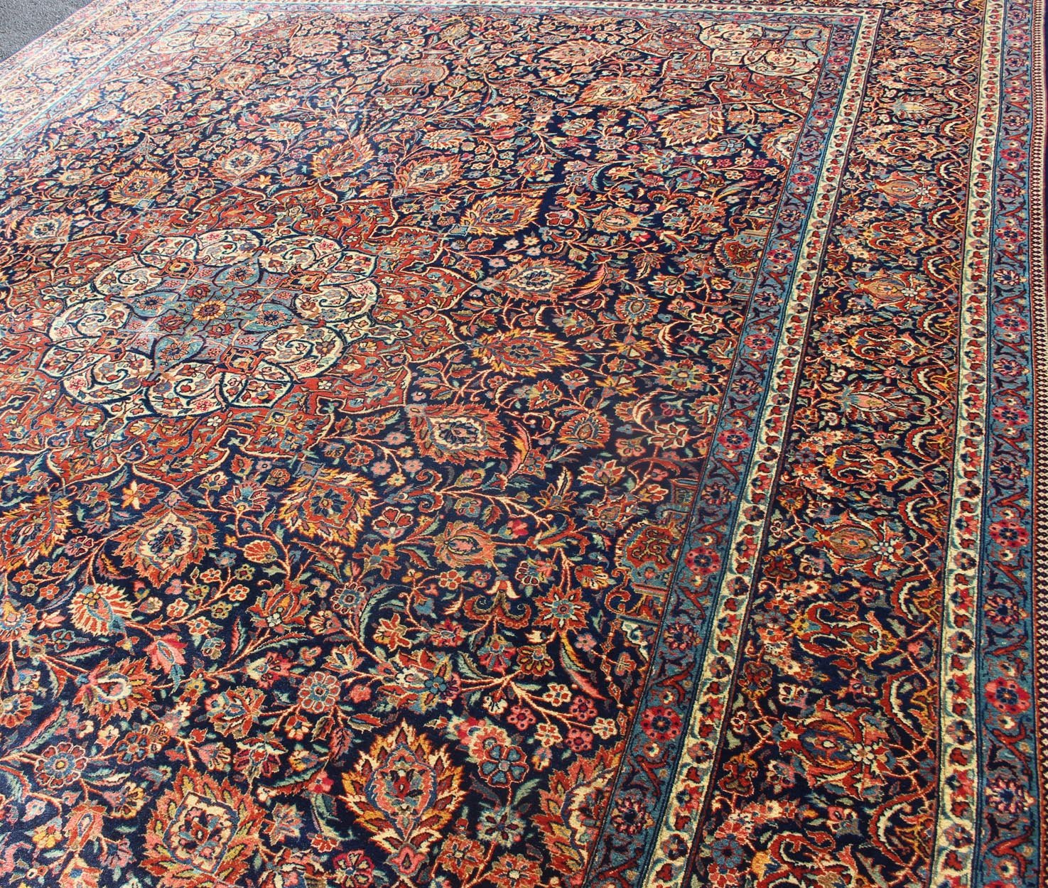 Persian Kashan All - Over Floral Fine Weave in Navy Background Fine Kashan Red and blue antique Persian Kashan rug with Arabesque blossom design, rug EB - CON1 - 13001, country of origin / type: Iran / Kashan, circa 1910 Distinct colors that a... - Keivan Woven ArtsEB - CON1 - 13001 - 12597Rug
