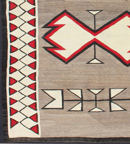 Antique Ganado Navajo Rug With Geometric Design in Red, Black, Ivory and Gray This beautiful antique Navajo textile is from the Ganado region and features a carded gray field with aniline - dyed red and black diamond crosses. The unique border of ... - Keivan Woven ArtsEBD - 1002 - 6544Rug