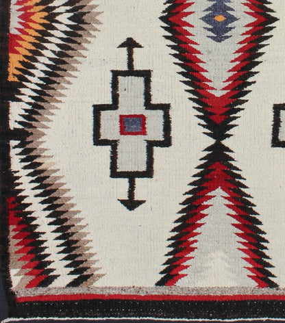 Antique Navajo Rug in Gray, Ivory, Black, Orange, and Red This Southwestern Navajo rug features designs and coloring most consistent with textiles that originated at the Ganado Trading Post. It's woven of native, hand - spun wool in natural color... - Keivan Woven ArtsEBD - 1007 - 6470Rug