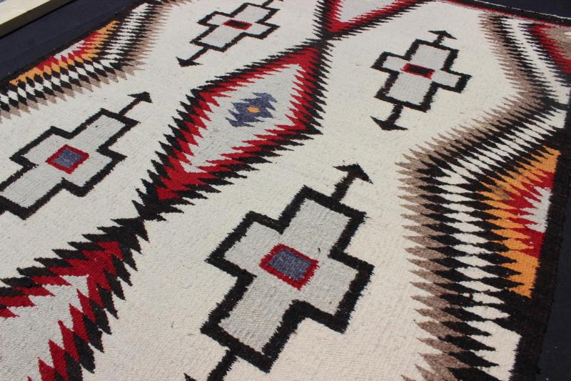 Antique Navajo Rug in Gray, Ivory, Black, Orange, and Red This Southwestern Navajo rug features designs and coloring most consistent with textiles that originated at the Ganado Trading Post. It's woven of native, hand - spun wool in natural color... - Keivan Woven ArtsEBD - 1007 - 6470Rug