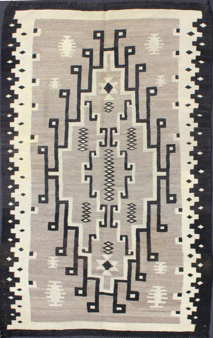 American Navajo Rug with Medallion Design with Greys, Creams, Ivory and Charcoal This intriguing Navajo rug was woven in the United States during the first half of the 20th century. The exciting and unique composition boasts a captivating geomet... - Keivan Woven ArtsEBD - 1016 - 6552Rug