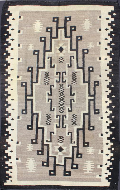 American Navajo Rug with Medallion Design with Greys, Creams, Ivory and Charcoal This intriguing Navajo rug was woven in the United States during the first half of the 20th century. The exciting and unique composition boasts a captivating geomet... - Keivan Woven ArtsEBD - 1016 - 6552Rug