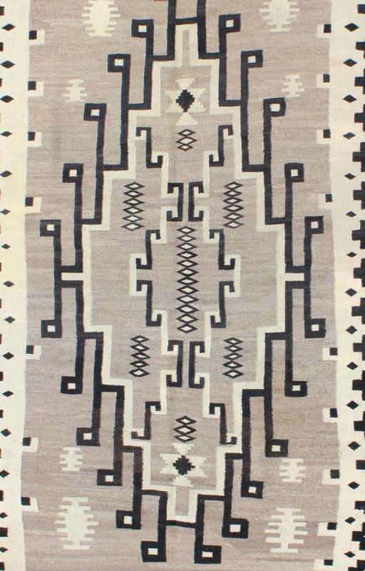 American Navajo Rug with Medallion Design with Greys, Creams, Ivory and Charcoal This intriguing Navajo rug was woven in the United States during the first half of the 20th century. The exciting and unique composition boasts a captivating geomet... - Keivan Woven ArtsEBD - 1016 - 6552Rug