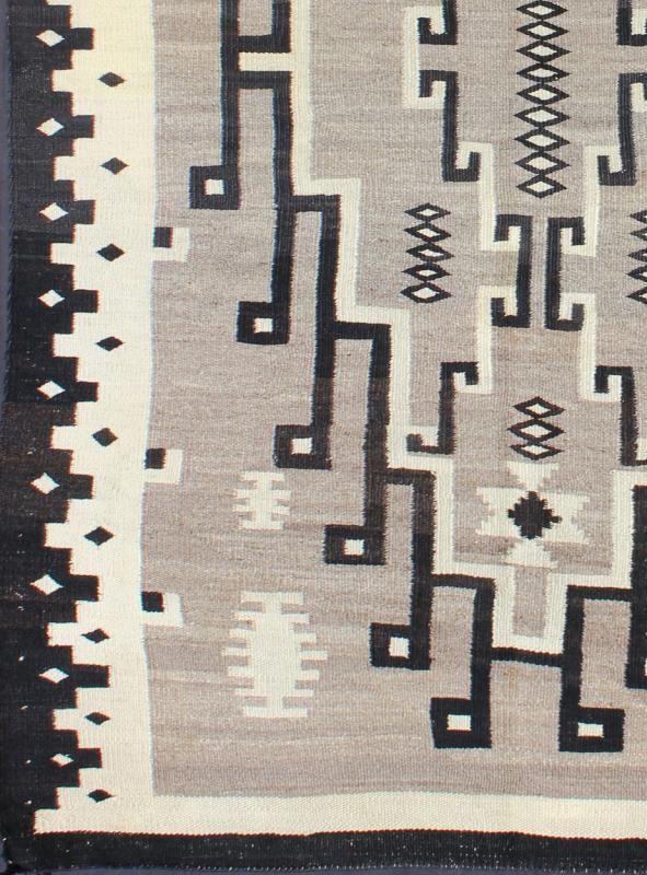 American Navajo Rug with Medallion Design with Greys, Creams, Ivory and Charcoal This intriguing Navajo rug was woven in the United States during the first half of the 20th century. The exciting and unique composition boasts a captivating geomet... - Keivan Woven ArtsEBD - 1016 - 6552Rug