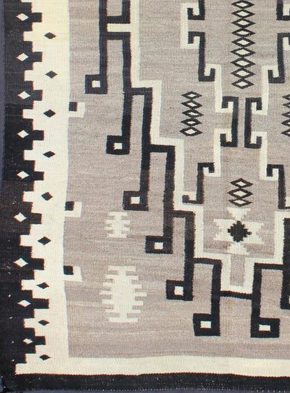 American Navajo Rug with Medallion Design with Greys, Creams, Ivory and Charcoal This intriguing Navajo rug was woven in the United States during the first half of the 20th century. The exciting and unique composition boasts a captivating geomet... - Keivan Woven ArtsEBD - 1016 - 6552Rug