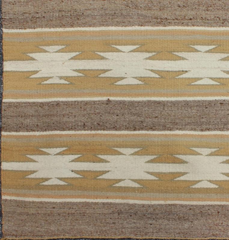 Vintage USA Navajo Flat - Weave in Earthy Tones 1950s American Navajo Kilim with geometric design in muted marigold, grey and ivory rug EBD - 1018, country of origin / type: America / Navajo, circa 1950 This intriguing antique Navajo Kilim, c... - Keivan Woven ArtsEBD - 1018 - 6556Rug