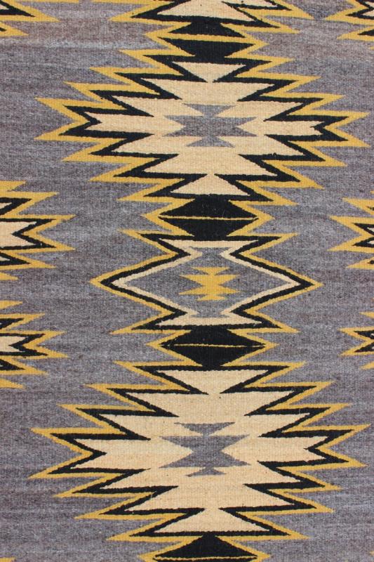 Geometric Medallion Tribal Navajo Kilim with Cream, Gold, Gray and Black This intriguing antique Navajo Kilim, circa 1940 was woven in the United States during the first half of the 20th century. The exciting and unique composition boasts a capt... - Keivan Woven ArtsEBD - 1025 - 6564Rug