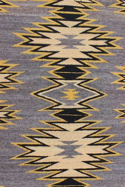 Geometric Medallion Tribal Navajo Kilim with Cream, Gold, Gray and Black This intriguing antique Navajo Kilim, circa 1940 was woven in the United States during the first half of the 20th century. The exciting and unique composition boasts a capt... - Keivan Woven ArtsEBD - 1025 - 6564Rug
