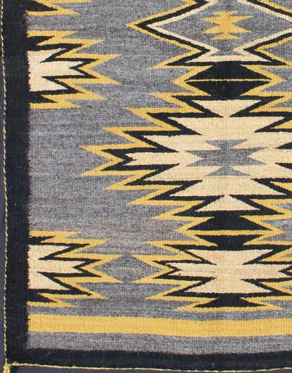 Geometric Medallion Tribal Navajo Kilim with Cream, Gold, Gray and Black This intriguing antique Navajo Kilim, circa 1940 was woven in the United States during the first half of the 20th century. The exciting and unique composition boasts a capt... - Keivan Woven ArtsEBD - 1025 - 6564Rug