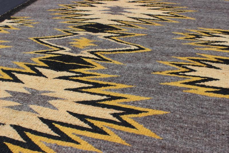 Geometric Medallion Tribal Navajo Kilim with Cream, Gold, Gray and Black This intriguing antique Navajo Kilim, circa 1940 was woven in the United States during the first half of the 20th century. The exciting and unique composition boasts a capt... - Keivan Woven ArtsEBD - 1025 - 6564Rug