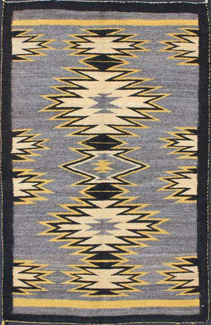 Geometric Medallion Tribal Navajo Kilim with Cream, Gold, Gray and Black This intriguing antique Navajo Kilim, circa 1940 was woven in the United States during the first half of the 20th century. The exciting and unique composition boasts a capt... - Keivan Woven ArtsEBD - 1025 - 6564Rug