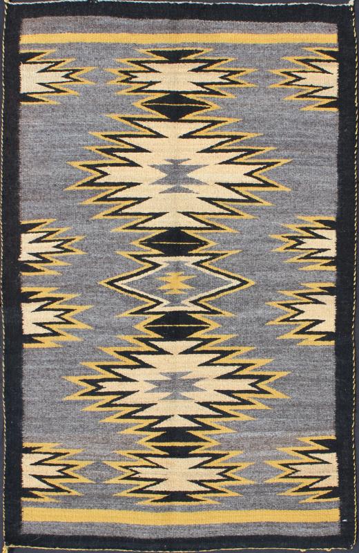 Geometric Medallion Tribal Navajo Kilim with Cream, Gold, Gray and Black This intriguing antique Navajo Kilim, circa 1940 was woven in the United States during the first half of the 20th century. The exciting and unique composition boasts a capt... - Keivan Woven ArtsEBD - 1025 - 6564Rug