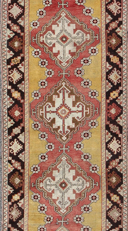 Antique Turkish Oushak Long Runner with Medallions in Brown and Goldish Yellow. Salmon, Brown and Goldish Yellow antique Turkish Oushak runner with medallions, rug EL - 13005, country of origin / type: Turkey / Oushak, circa 1930 This antique ... - Keivan Woven ArtsEL - 13005 - 1450Rug