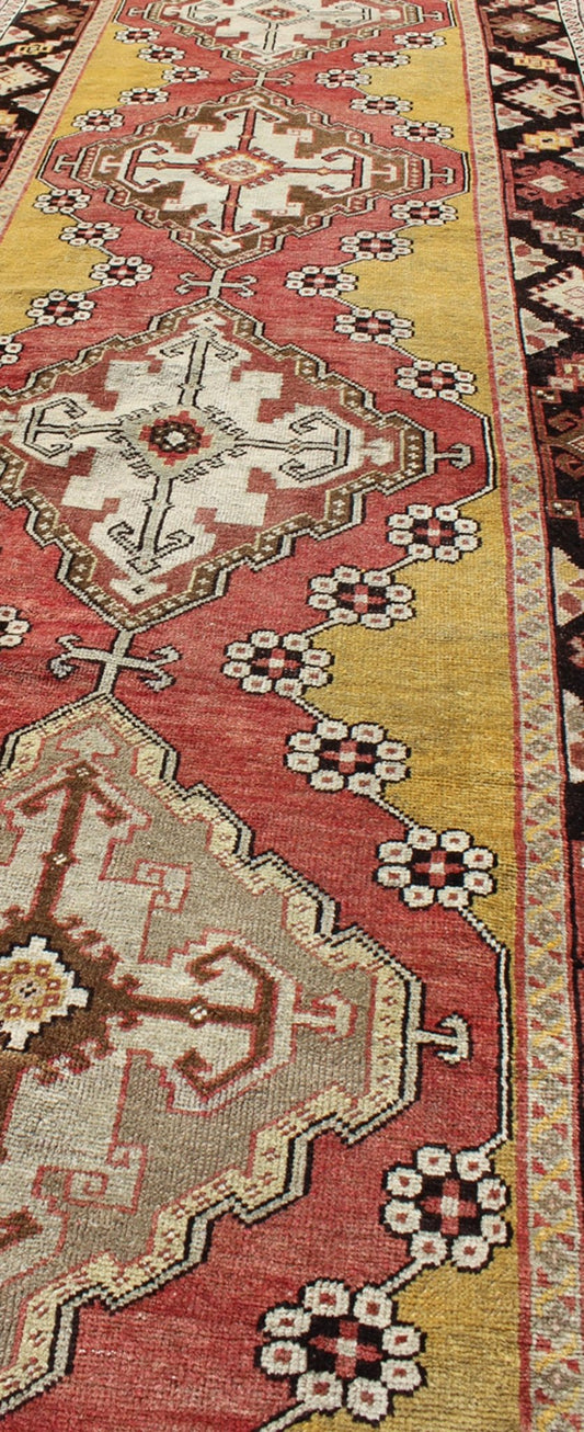 Antique Turkish Oushak Long Runner with Medallions in Brown and Goldish Yellow. Salmon, Brown and Goldish Yellow antique Turkish Oushak runner with medallions, rug EL - 13005, country of origin / type: Turkey / Oushak, circa 1930 This antique ... - Keivan Woven ArtsEL - 13005 - 1450Rug