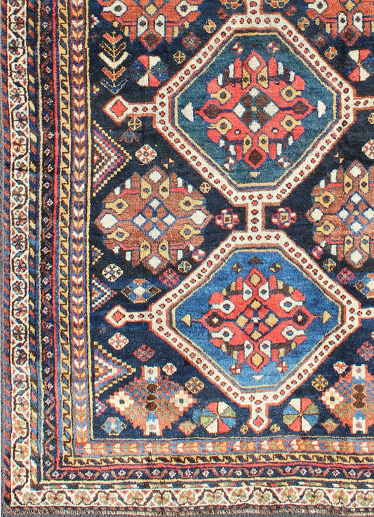 Antique Persian Qashqai Rug with Four - Medallion Design in Blue, Red, Brown Tones kwarugs Tribal Qashqai Gallery rug from Persia with geometric designs in multi - colors, rug ema - 7551, country of origin / type: Iran / Qashqai, circa 1910. Th... - Keivan Woven ArtsEMA - 7551 - 9798Rug