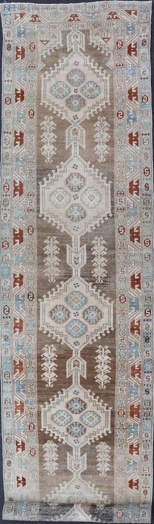 Long Persian Heriz Runner with Central Medallions in Brown, Blue, Tan & Red. Antique Heriz Persian long runner with multi - medallion and geometric design from Persia, rug EMA - 7568 , country of origin / type: Iran / Heriz, circa 1920 This m... - Keivan Woven ArtsEMA - 7568 - 9838
