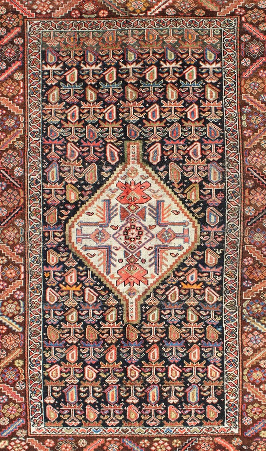 Antique Persian Kurdish Colorful Rug with Medallion and Geometric Motifs kwarugs Geometric antique Kurdish rug from Persia with medallion and all - over design, rug ema - 7570, country of origin / type: Iran / Kurdish, circa 1910. This antiqu... - Keivan Woven ArtsEMA - 7570 - 9842Rug