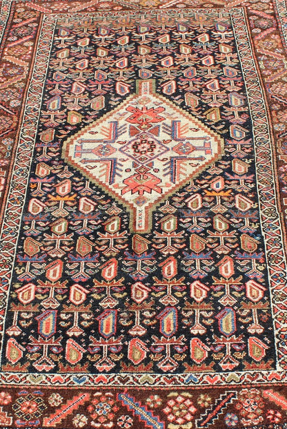 Antique Persian Kurdish Colorful Rug with Medallion and Geometric Motifs kwarugs Geometric antique Kurdish rug from Persia with medallion and all - over design, rug ema - 7570, country of origin / type: Iran / Kurdish, circa 1910. This antiqu... - Keivan Woven ArtsEMA - 7570 - 9842Rug