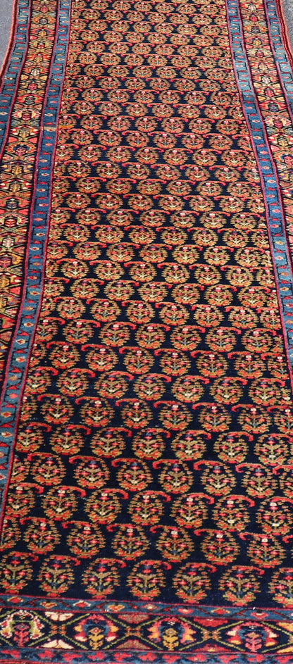 Antique Persian Malayer Paisley Design Runner in Red, Orange, and Blue Measures 3'7 x 18'7 This antique Persian Malayer features a denim blue guard for the small banded border, decorated with modest motifs in varying shades of blue, gree... - Keivan Woven ArtsEMA - 7585 - 10018Rug