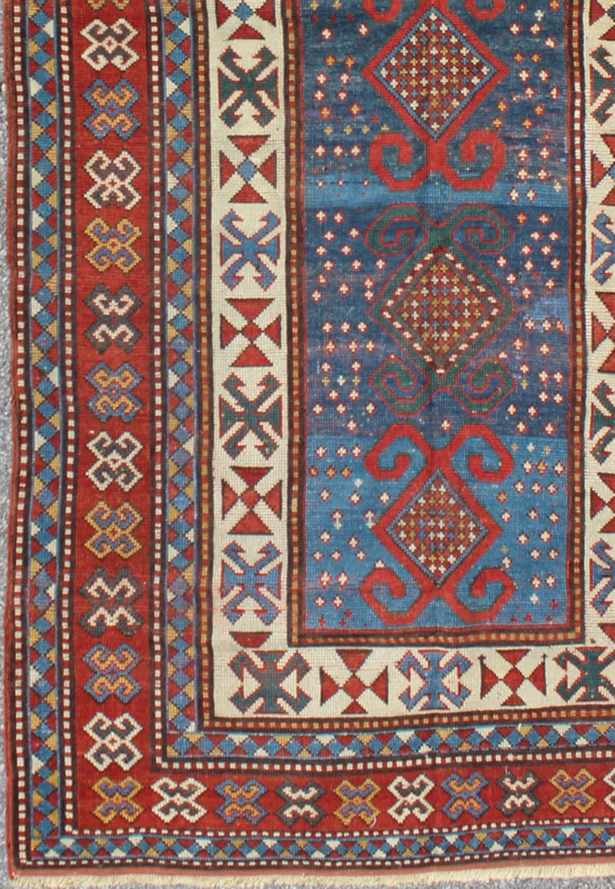 Red and Blue Antique Caucasian Kazak Rug with Vertical Tribal Medallions. Keivan Woven Arts / rug EMAC - 001, country of origin / type: Caucasus / Kazak, circa 1890 Measures: 4' x 8'10 The field design of this late 19th century antique Caucasian K... - Keivan Woven ArtsEMAC - 001 - 8801Rug