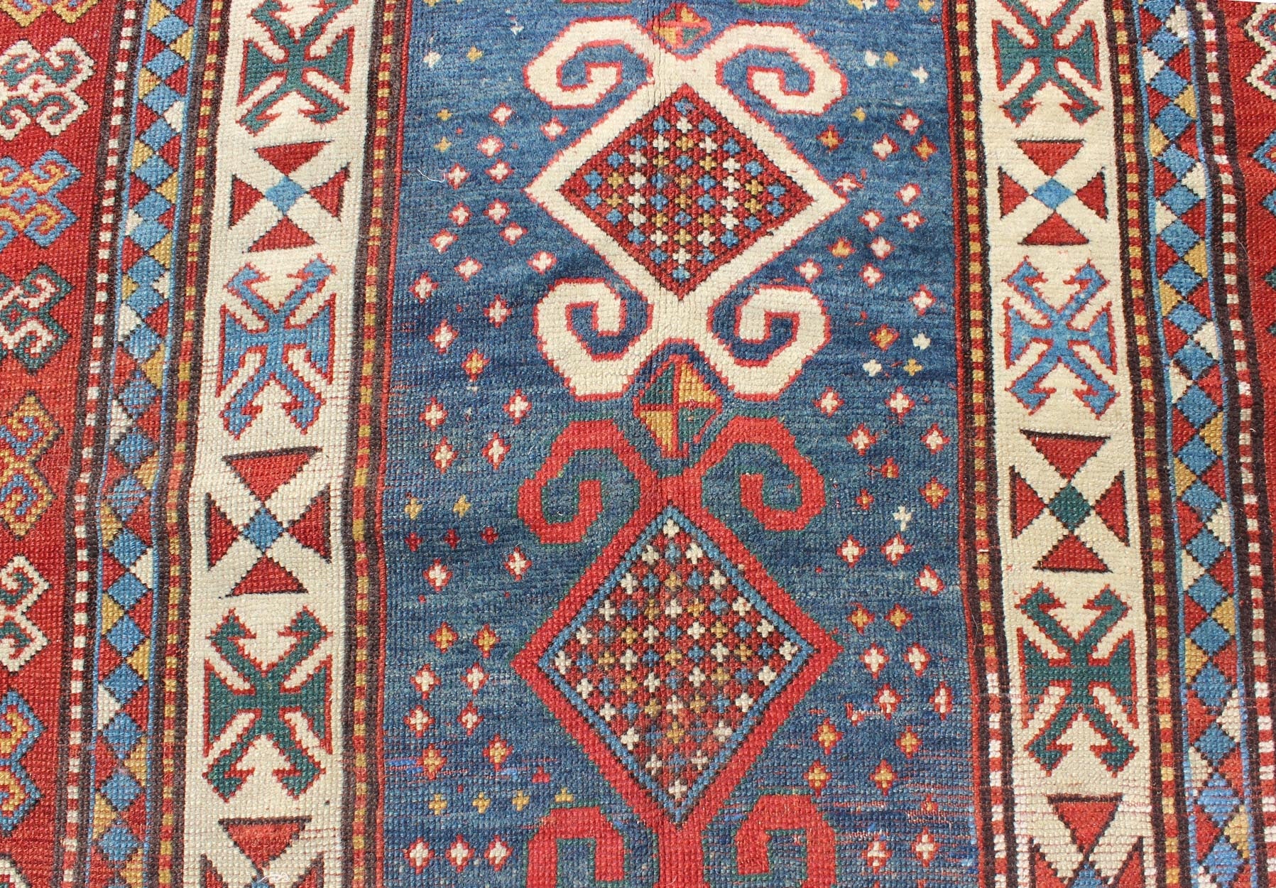 Red and Blue Antique Caucasian Kazak Rug with Vertical Tribal Medallions. Keivan Woven Arts / rug EMAC - 001, country of origin / type: Caucasus / Kazak, circa 1890 Measures: 4' x 8'10 The field design of this late 19th century antique Caucasian K... - Keivan Woven ArtsEMAC - 001 - 8801Rug