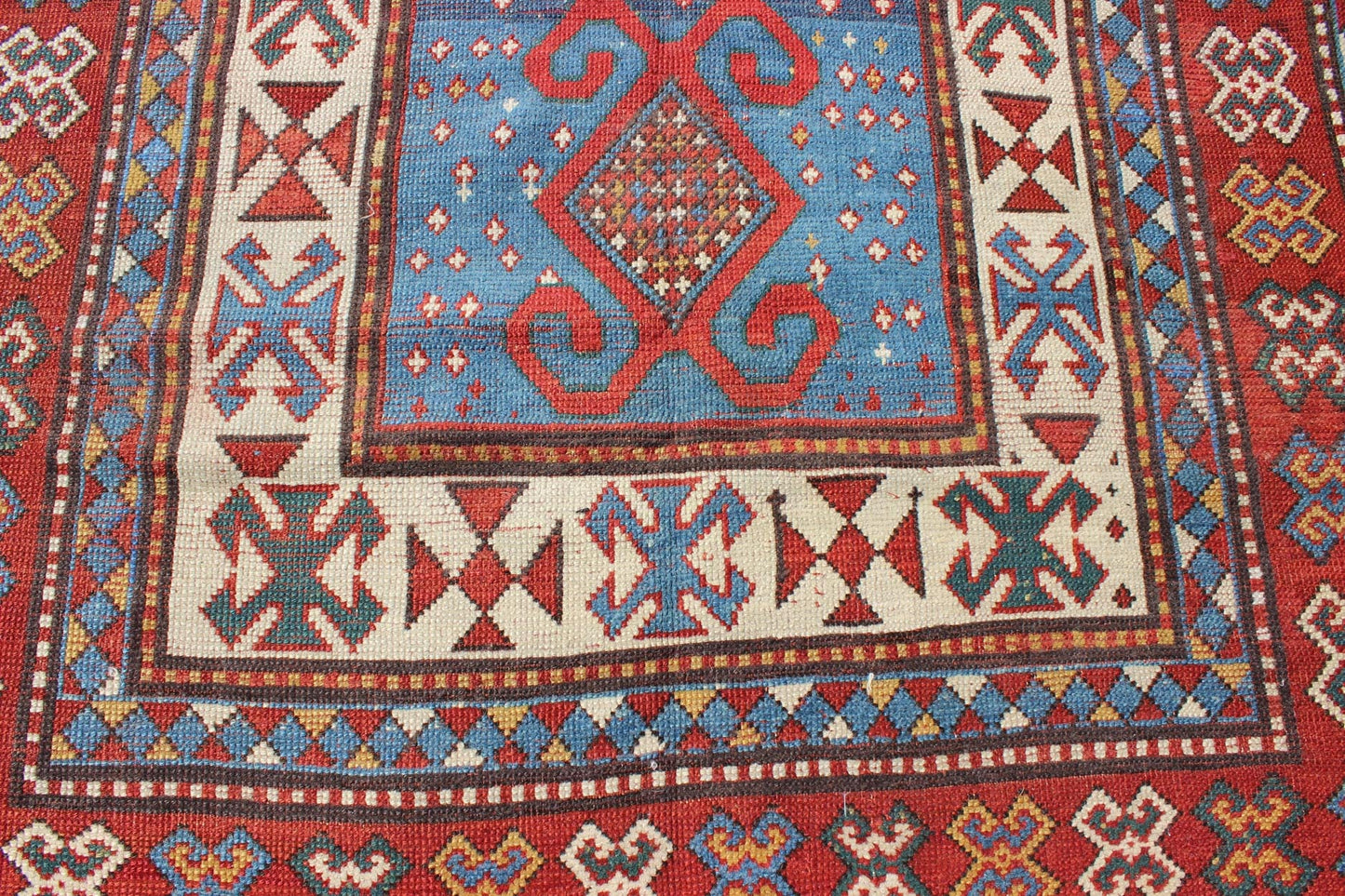 Red and Blue Antique Caucasian Kazak Rug with Vertical Tribal Medallions. Keivan Woven Arts / rug EMAC - 001, country of origin / type: Caucasus / Kazak, circa 1890 Measures: 4' x 8'10 The field design of this late 19th century antique Caucasian K... - Keivan Woven ArtsEMAC - 001 - 8801Rug