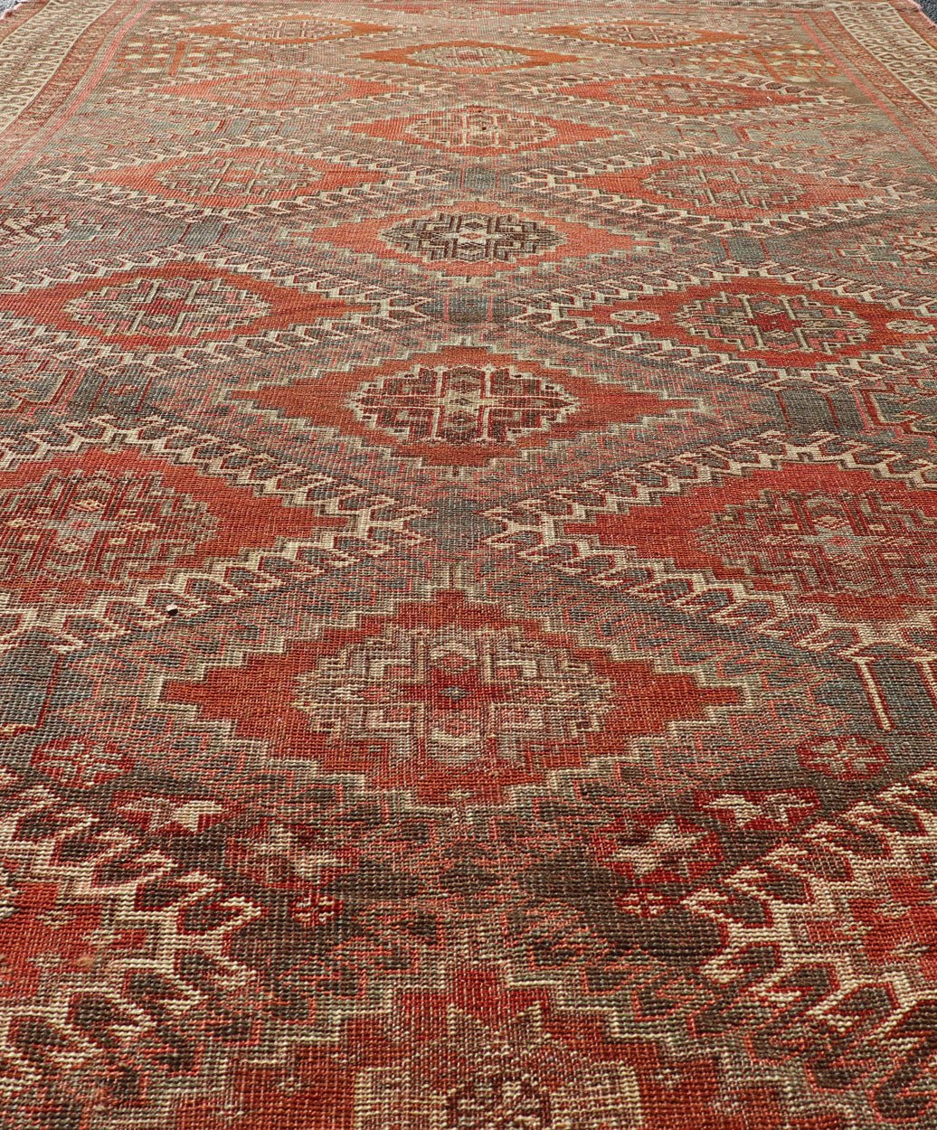 Measures: 5'6 x 9'6 Geometric Antique Persian Shiraz Rug with All - Over Medallion Design. Keivan Woven Arts / rug EMB - 22105 - 15105, country of origin / type: Iran / Shiraz, circa 1930. Persian Shiraz rug (circa early 20th century) features a u... - Keivan Woven ArtsEMB - 22105 - 15105 - 20800