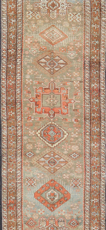 Measures: 3'4 x 15'2 Antique Persian Long Serapi Runner with Multi Medallions in Green, Blue, Orange. Keivan Woven Arts / rug/EMB - 22106 - 15050 country of origin / type: Iran / Karadjeh, circa 1910 This magnificent Persian Searpi - Heriz bears a... - Keivan Woven ArtsEMB - 22106 - 15050 - 20535Rug