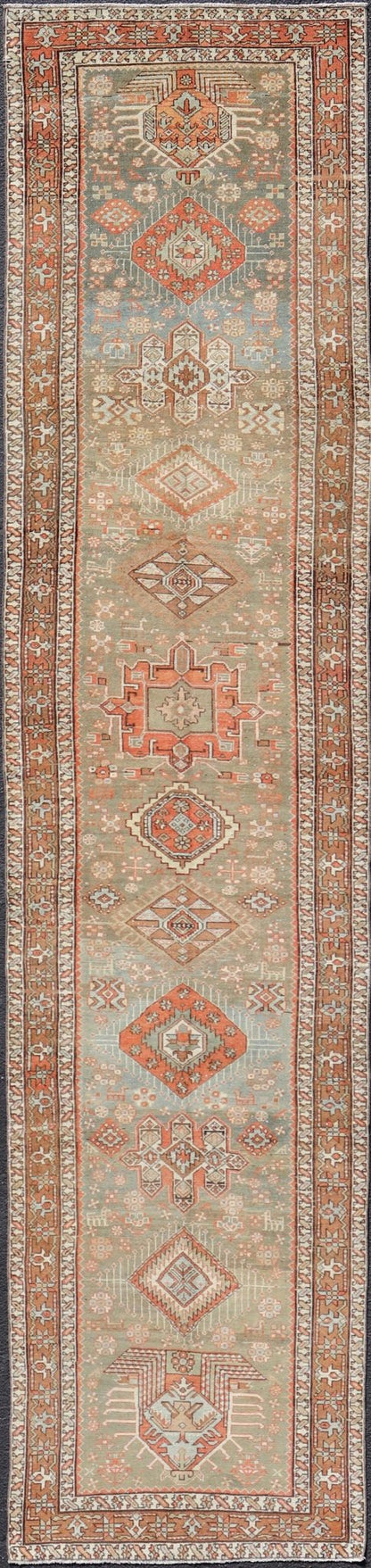 Measures: 3'4 x 15'2 Antique Persian Long Serapi Runner with Multi Medallions in Green, Blue, Orange. Keivan Woven Arts / rug/EMB - 22106 - 15050 country of origin / type: Iran / Karadjeh, circa 1910 This magnificent Persian Searpi - Heriz bears a... - Keivan Woven ArtsEMB - 22106 - 15050 - 20535Rug