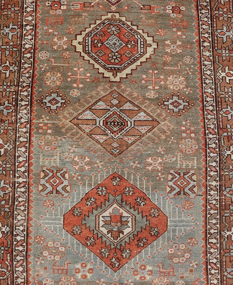Measures: 3'4 x 15'2 Antique Persian Long Serapi Runner with Multi Medallions in Green, Blue, Orange. Keivan Woven Arts / rug/EMB - 22106 - 15050 country of origin / type: Iran / Karadjeh, circa 1910 This magnificent Persian Searpi - Heriz bears a... - Keivan Woven ArtsEMB - 22106 - 15050 - 20535Rug