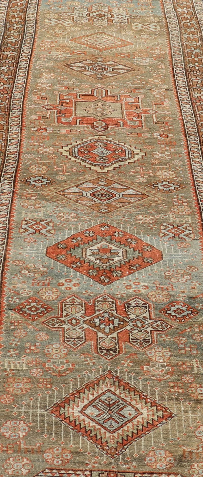 Measures: 3'4 x 15'2 Antique Persian Long Serapi Runner with Multi Medallions in Green, Blue, Orange. Keivan Woven Arts / rug/EMB - 22106 - 15050 country of origin / type: Iran / Karadjeh, circa 1910 This magnificent Persian Searpi - Heriz bears a... - Keivan Woven ArtsEMB - 22106 - 15050 - 20535Rug