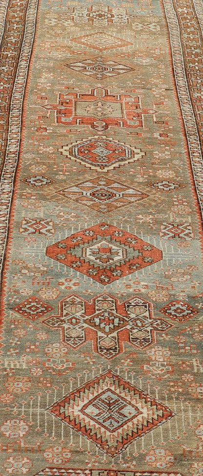 Measures: 3'4 x 15'2 Antique Persian Long Serapi Runner with Multi Medallions in Green, Blue, Orange. Keivan Woven Arts / rug/EMB - 22106 - 15050 country of origin / type: Iran / Karadjeh, circa 1910 This magnificent Persian Searpi - Heriz bears a... - Keivan Woven ArtsEMB - 22106 - 15050 - 20535Rug