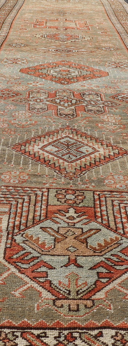Measures: 3'4 x 15'2 Antique Persian Long Serapi Runner with Multi Medallions in Green, Blue, Orange. Keivan Woven Arts / rug/EMB - 22106 - 15050 country of origin / type: Iran / Karadjeh, circa 1910 This magnificent Persian Searpi - Heriz bears a... - Keivan Woven ArtsEMB - 22106 - 15050 - 20535Rug