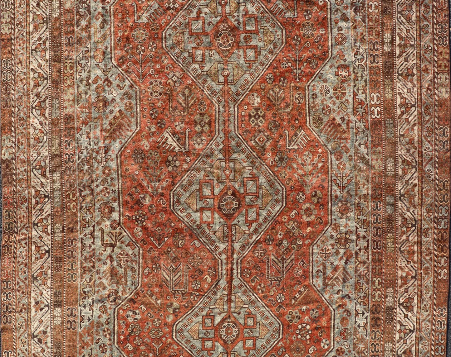 Measures: 7'0 x 10'1 Antique Persian Shiraz Rug With Medallions Geometric in Rusty Orange, Steel Blue. Keivan Woven Arts / rug EMB - 22108 - 15052, country of origin / type: Iran / Shiraz, circa 1920. This antique distressed Persian Shiraz rug (cir... - Keivan Woven ArtsEMB - 22108 - 15052 - 20547Rug