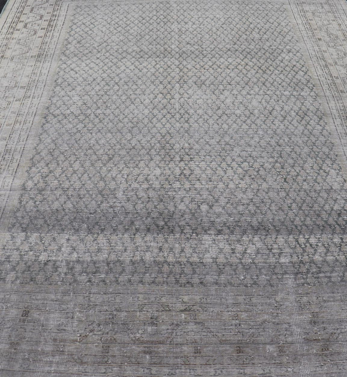 Measures: 8'0 x 11'2 Distressed Persian Antique Tabriz Carpet with Muted Floral Design in Light Gray Keivan Woven Arts/ rug EMB - 22115 - 15112, country of origin / type: Iran/ Tabriz, circa 1920. This muted antique distressed Persian Tabriz carpet ... - Keivan Woven ArtsEMB - 22115 - 15112 - 20830