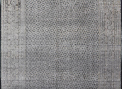 Measures: 8'0 x 11'2 Distressed Persian Antique Tabriz Carpet with Muted Floral Design in Light Gray Keivan Woven Arts/ rug EMB - 22115 - 15112, country of origin / type: Iran/ Tabriz, circa 1920. This muted antique distressed Persian Tabriz carpet ... - Keivan Woven ArtsEMB - 22115 - 15112 - 20830Rug