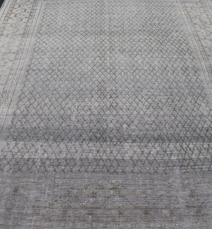 Measures: 8'0 x 11'2 Distressed Persian Antique Tabriz Carpet with Muted Floral Design in Light Gray Keivan Woven Arts/ rug EMB - 22115 - 15112, country of origin / type: Iran/ Tabriz, circa 1920. This muted antique distressed Persian Tabriz carpet ... - Keivan Woven ArtsEMB - 22115 - 15112 - 20830Rug