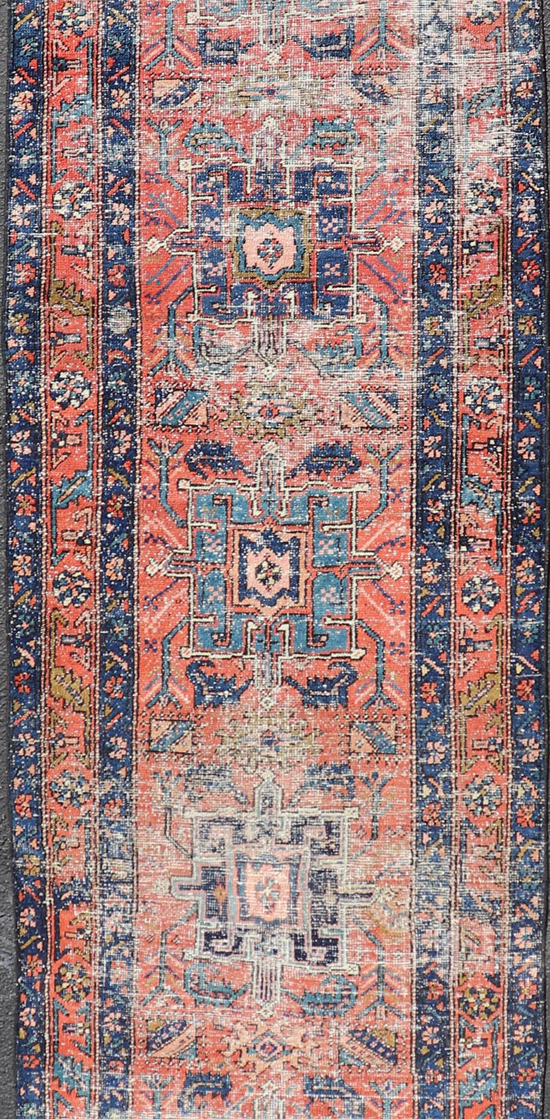 Geometric Medallion Antique Persian Heriz Runner in Orange - Red and Blue. Keivan Woven Arts / rug EMB - 22117 - 15011, country of origin / type: Iran / Heriz, circa 1920 Measures: 3'0 x 10'7 This antique Persian Heriz runner, from northwest Iran, dis... - Keivan Woven ArtsEMB - 22117 - 15011 - 20319Rug